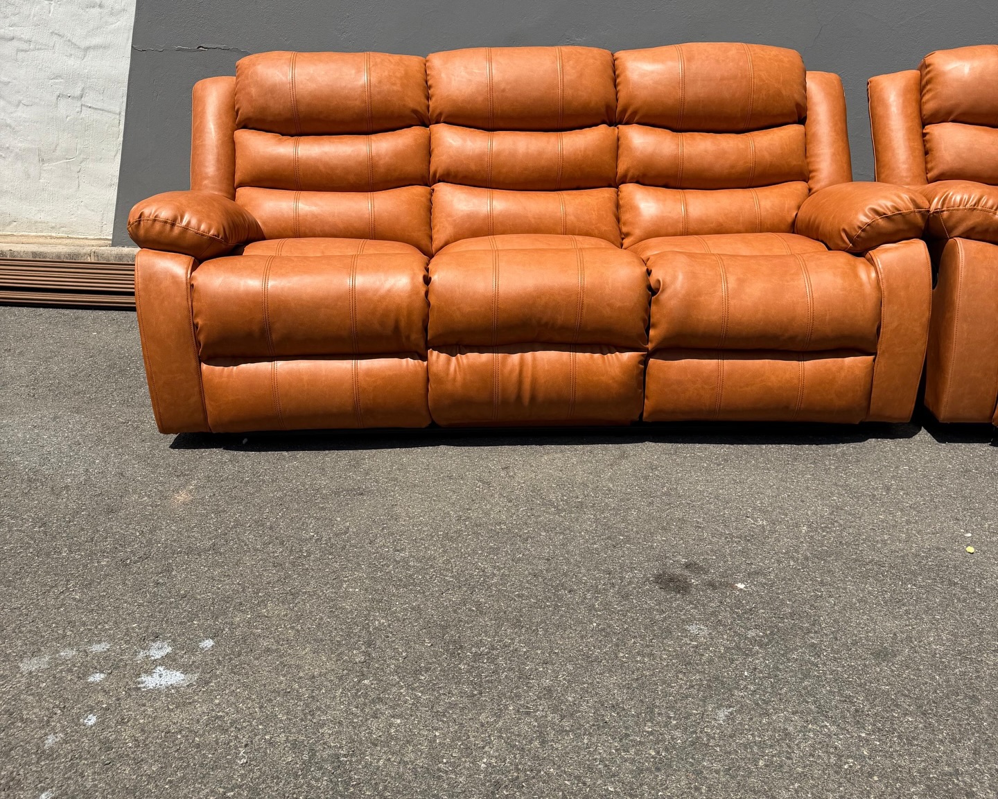 Tan Euro leather recliner arm detail